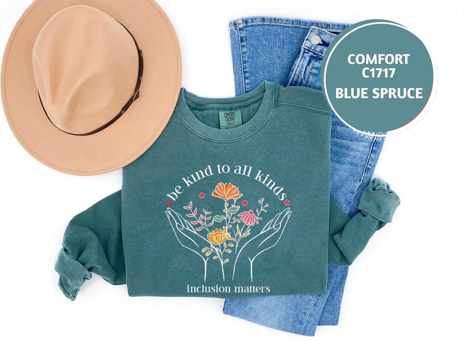 a pair of jeans, a hat, and a t - shirt on a white