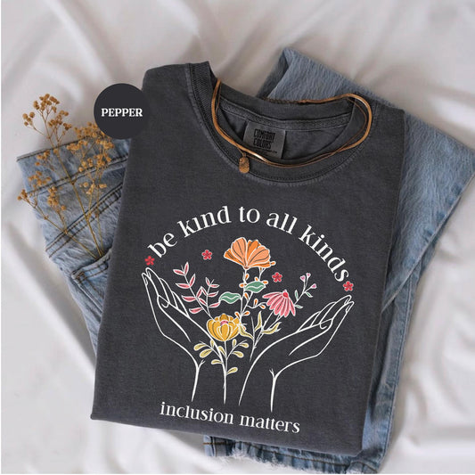 a t - shirt that says be kind of all kinds of induction matters
