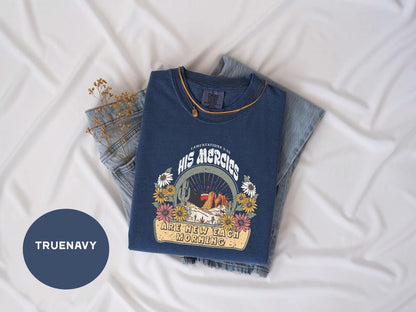 a pair of jeans and a t - shirt on a bed