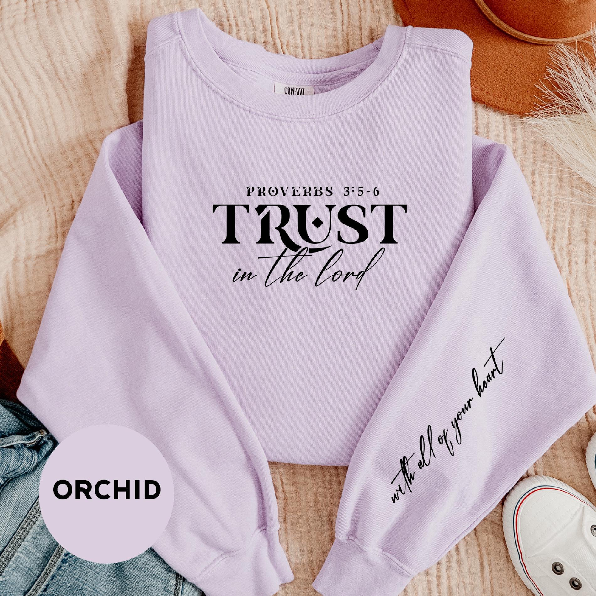 a purple sweatshirt with the words trust in the lord written on it