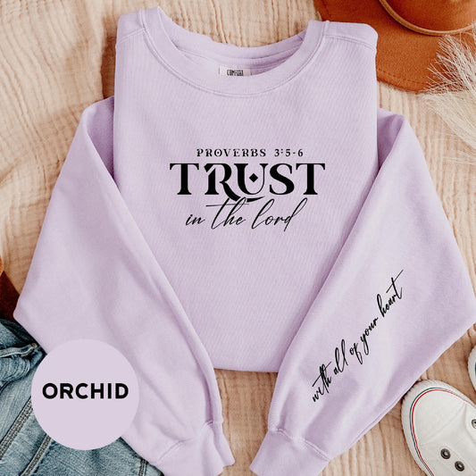 a purple sweatshirt with the words trust in the lord written on it