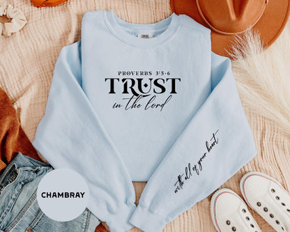 a light blue sweatshirt with the words trust in the lord printed on it