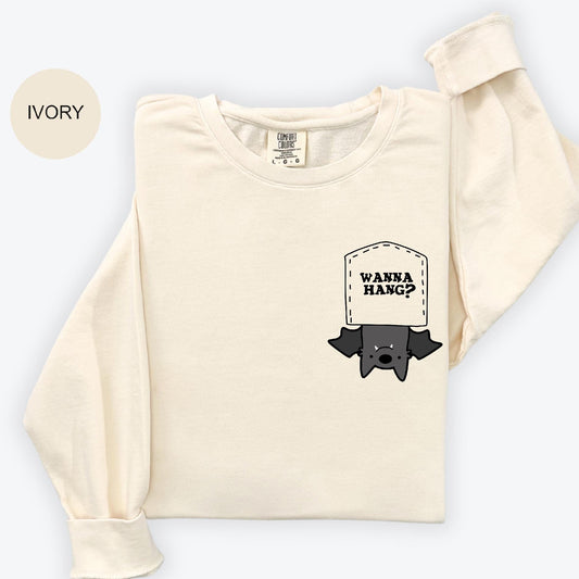 a white shirt with a black bat on it
