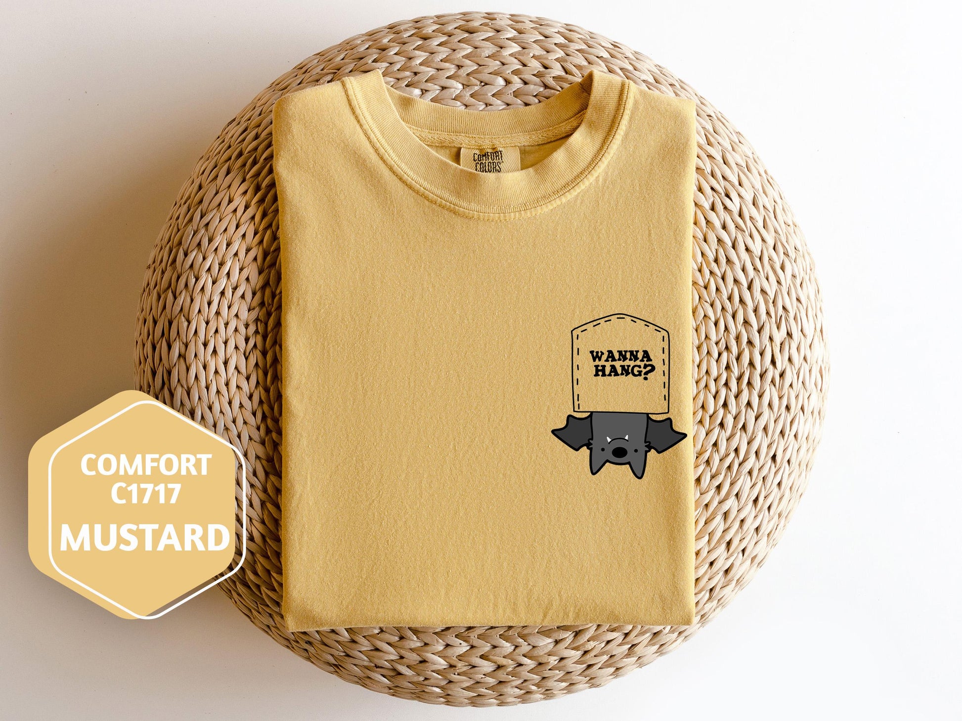 a yellow shirt with a black dog on it