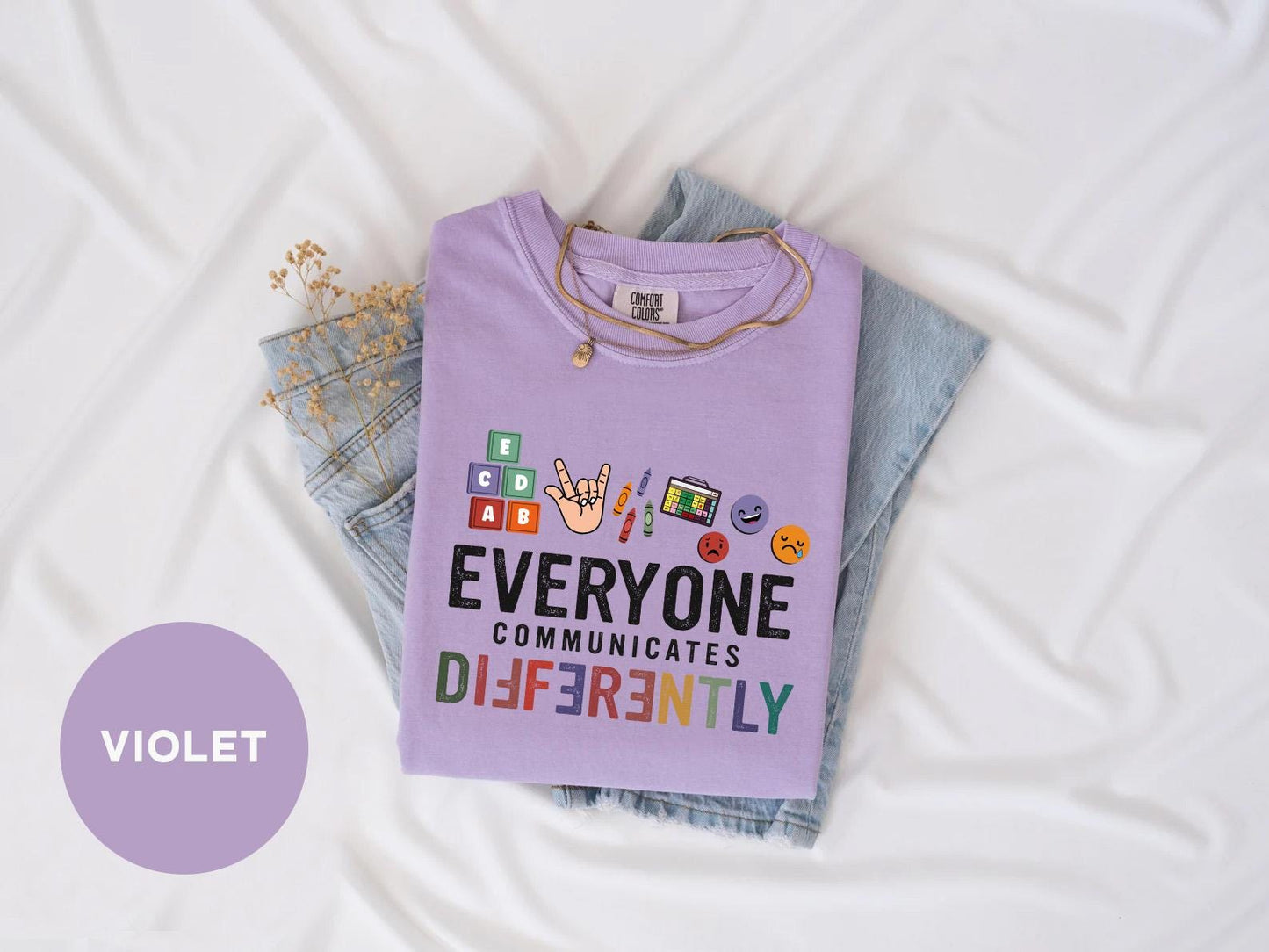 a t - shirt that says everyone communicate differently on it