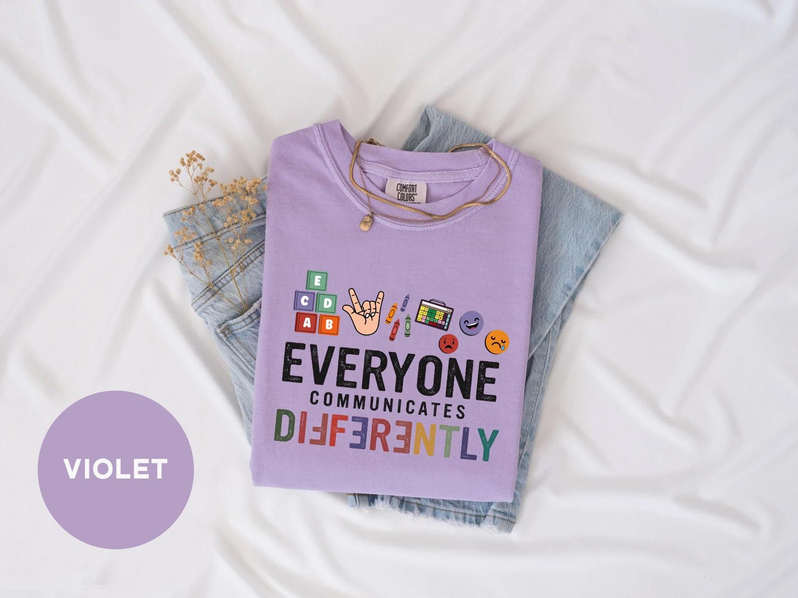 a t - shirt that says everyone communicate differently on it