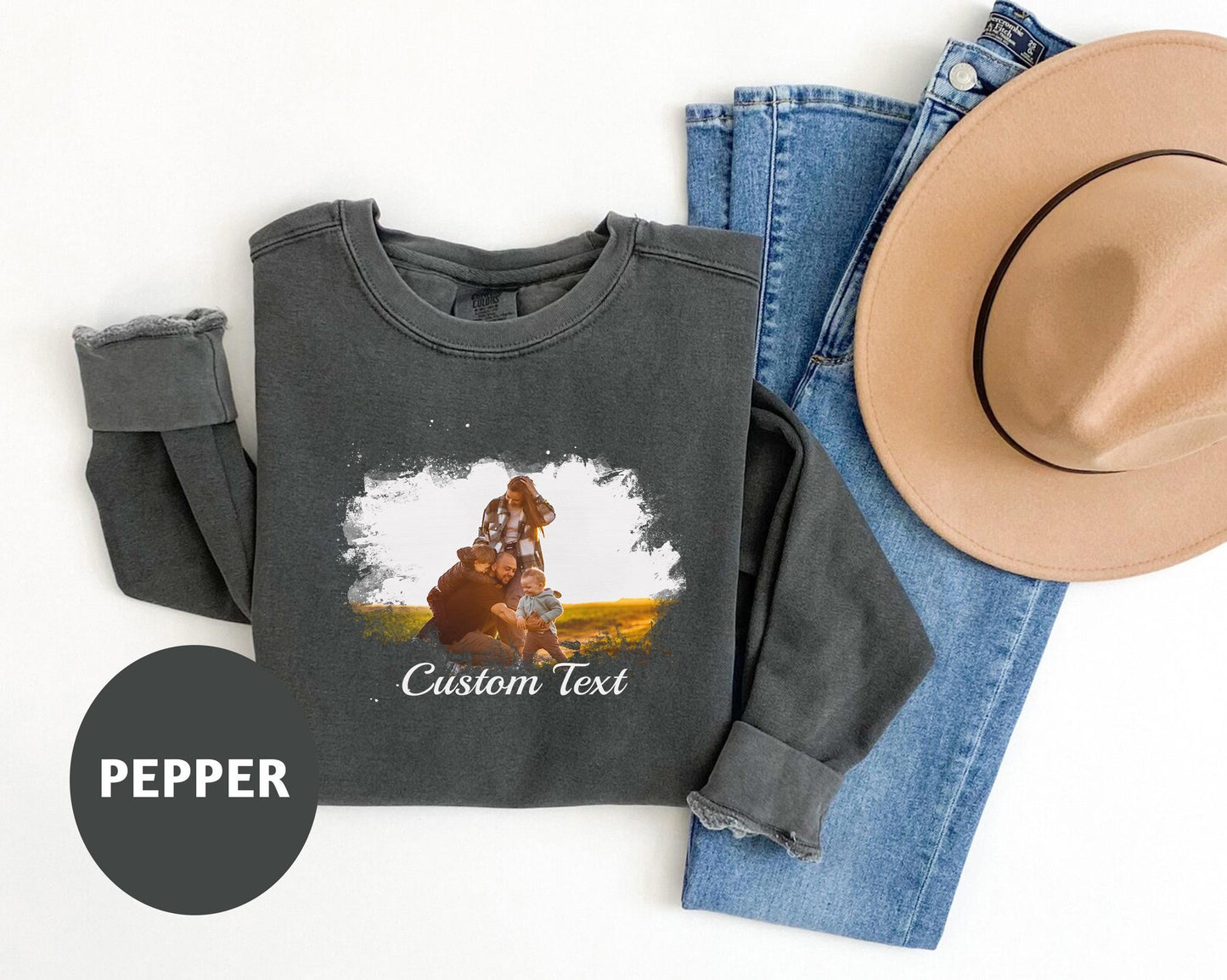 a hat, jeans, and a t - shirt with a picture of a cowboy