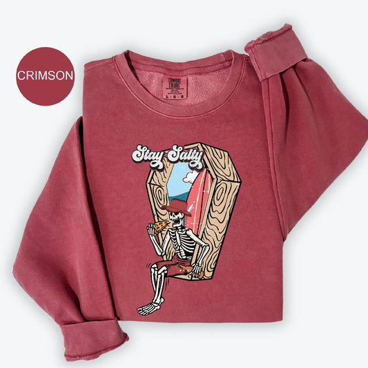 a red shirt with a picture of a skeleton on it