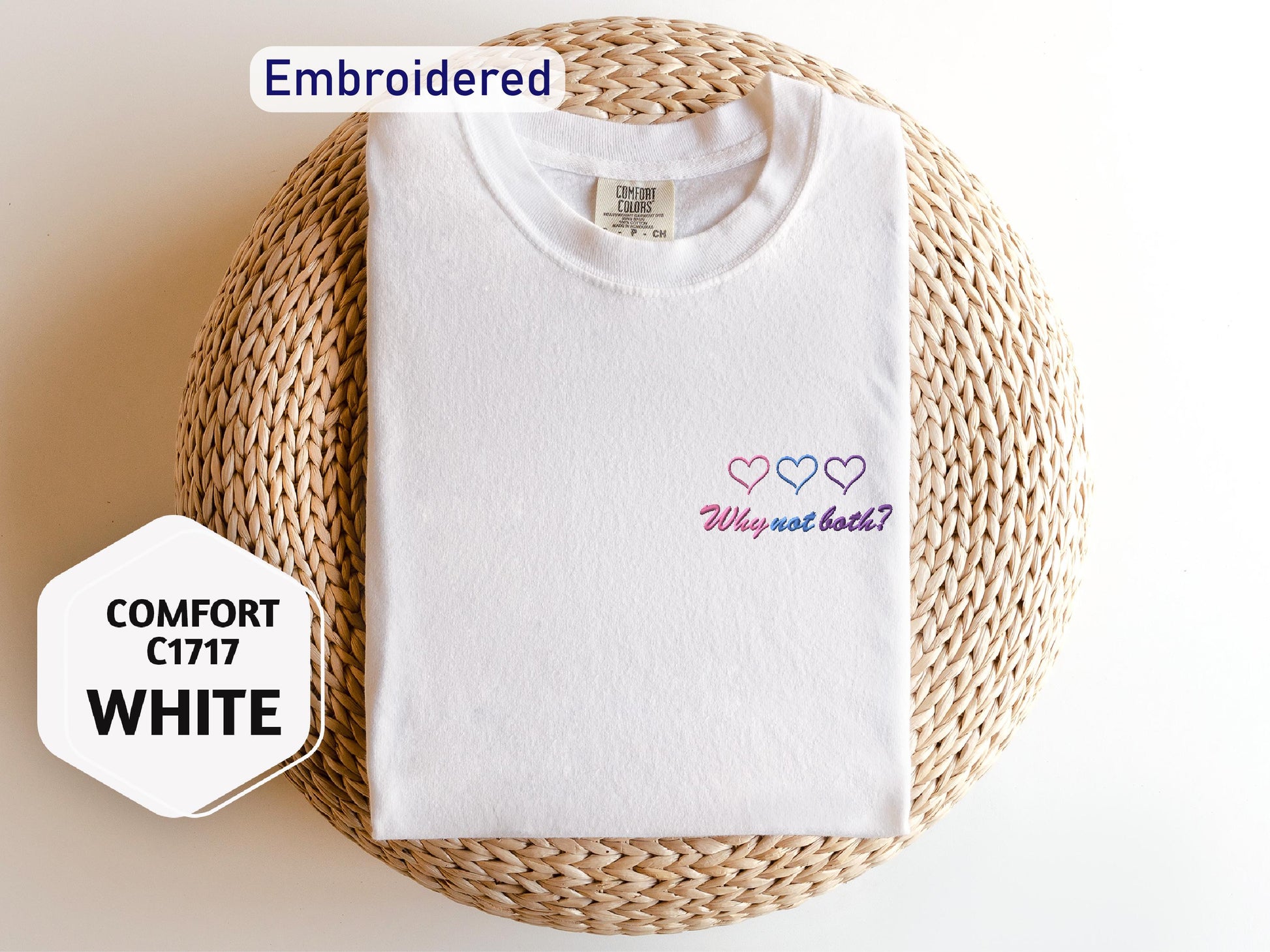a white t - shirt with hearts embroidered on it