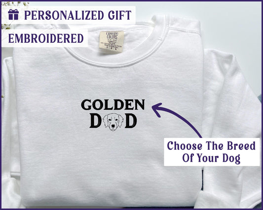 a white t - shirt with the words golden dad and a picture of a dog