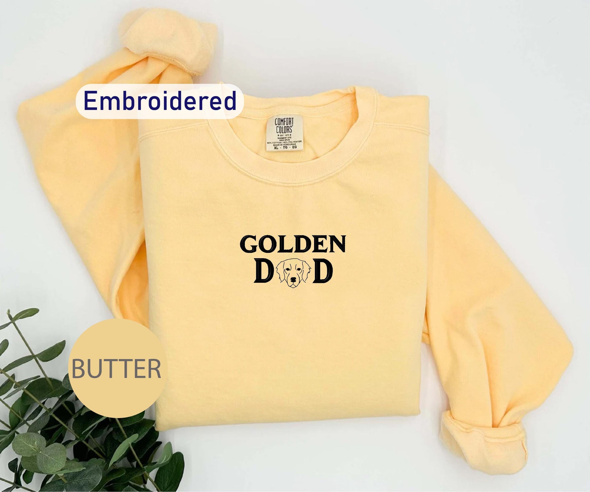 a yellow sweatshirt with the words golden dad on it