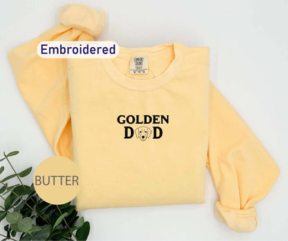 a yellow sweatshirt with the words golden dad on it
