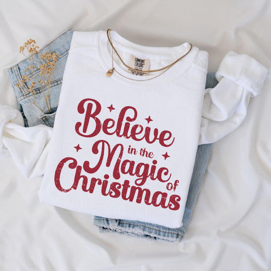 a t - shirt that says believe in the magic of christmas