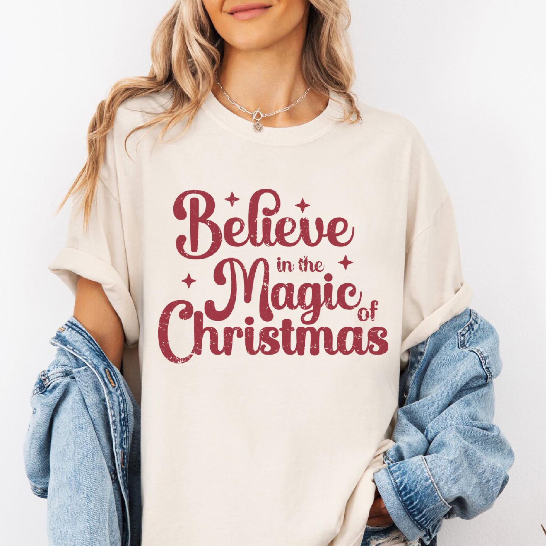 a woman wearing a t - shirt that says believe in the magic of christmas
