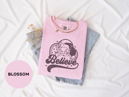 a pink t - shirt with a picture of a woman's face on it