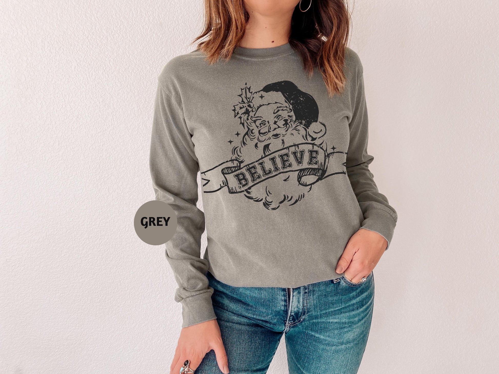 a woman wearing a sweatshirt with a picture of a man on it