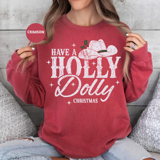 a woman sitting on a bed holding up a red sweatshirt