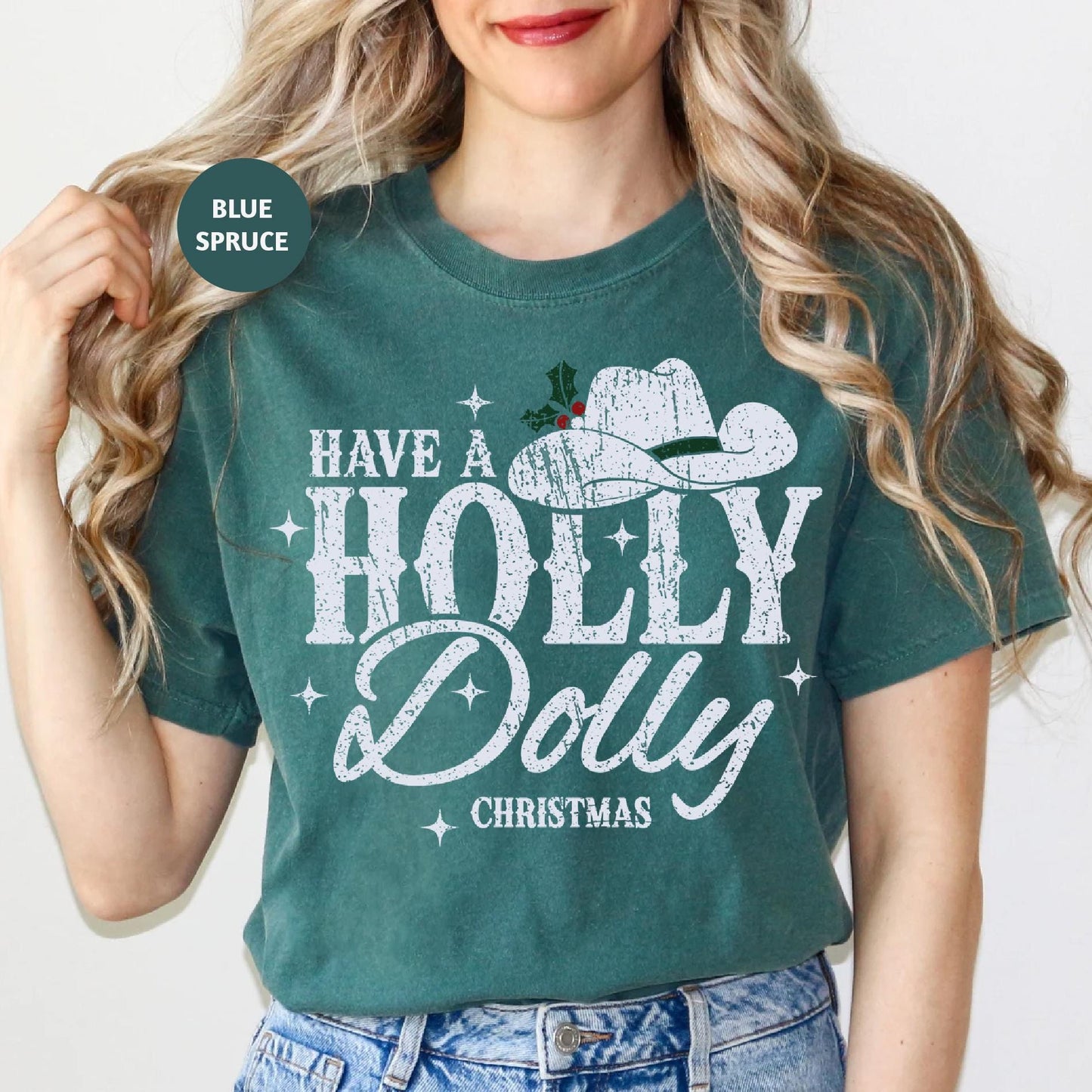 a woman wearing a t - shirt that says have a holly dolly christmas