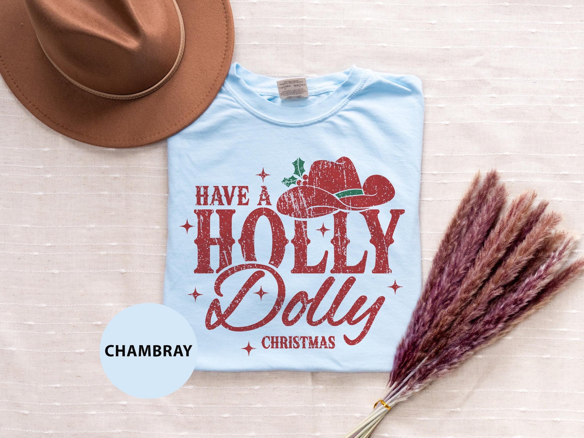 a t - shirt that says have a holly and dolly on it next to a