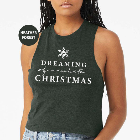 a woman wearing a tank top that says dreaming of a whole christmas