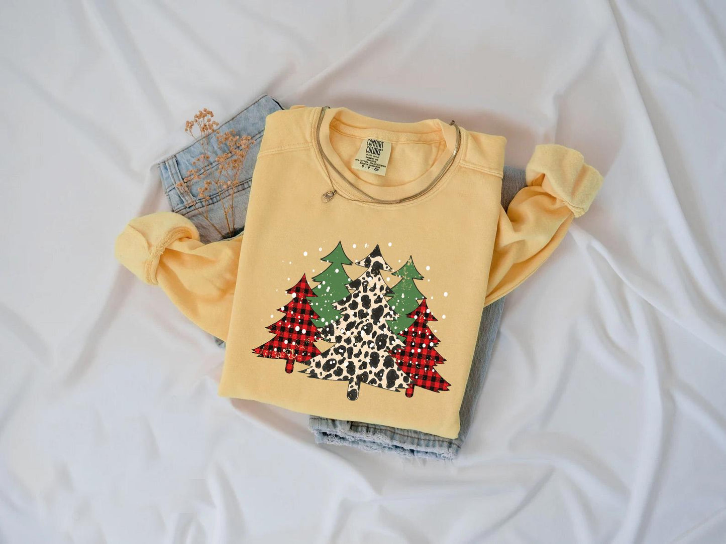 a yellow shirt with a leopard print on it