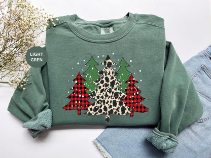 a green sweater with a leopard print christmas tree